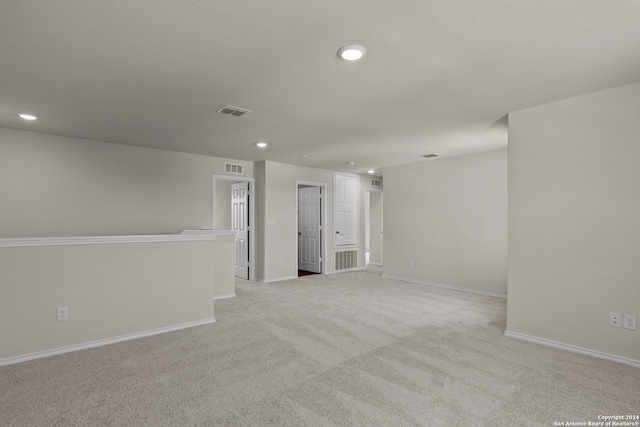 empty room with light colored carpet