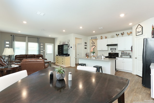 dining area with light hardwood / wood-style flooring