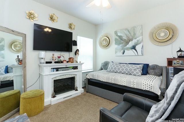 living room with ceiling fan, a premium fireplace, and carpet flooring