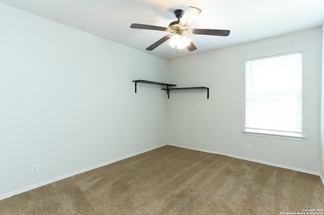 carpeted empty room with ceiling fan