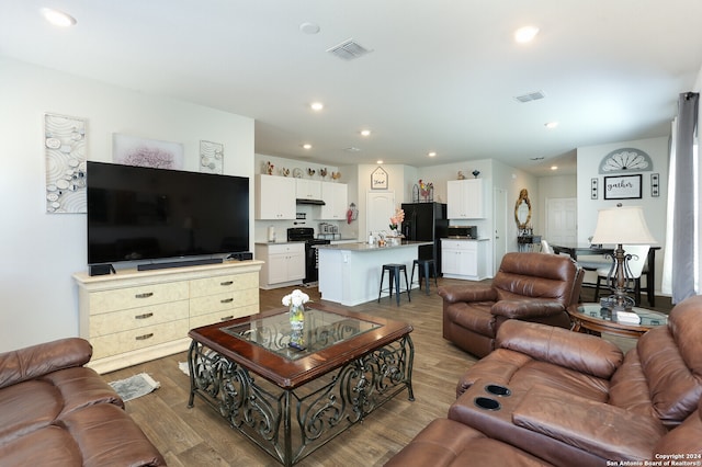 living room with hardwood / wood-style flooring