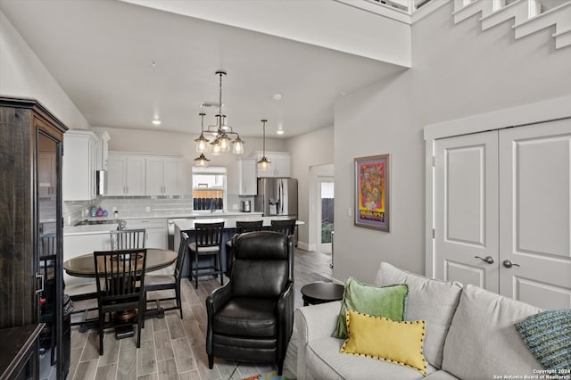 living room featuring light hardwood / wood-style floors and sink