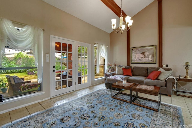 living room featuring a notable chandelier, lofted ceiling, and light tile patterned floors