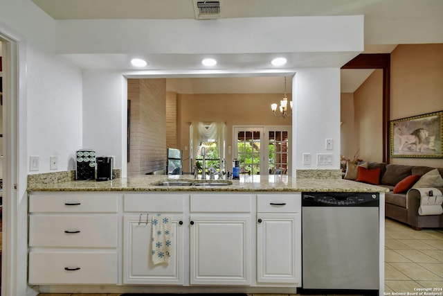 kitchen with dishwasher, sink, white cabinets, kitchen peninsula, and light tile patterned floors