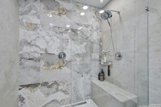 bathroom with tiled shower