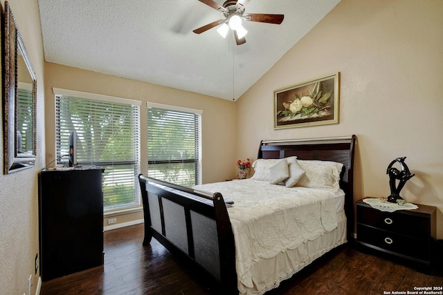 bedroom featuring a textured ceiling, lofted ceiling, ceiling fan, and dark hardwood / wood-style flooring