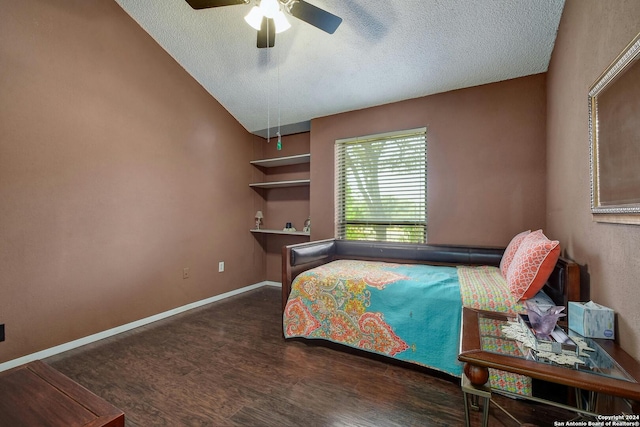 bedroom featuring a textured ceiling, vaulted ceiling, ceiling fan, and dark hardwood / wood-style flooring