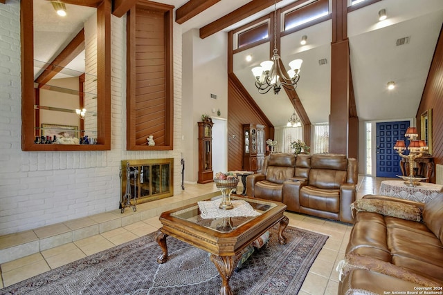 living room with a notable chandelier, beam ceiling, high vaulted ceiling, light tile patterned floors, and brick wall