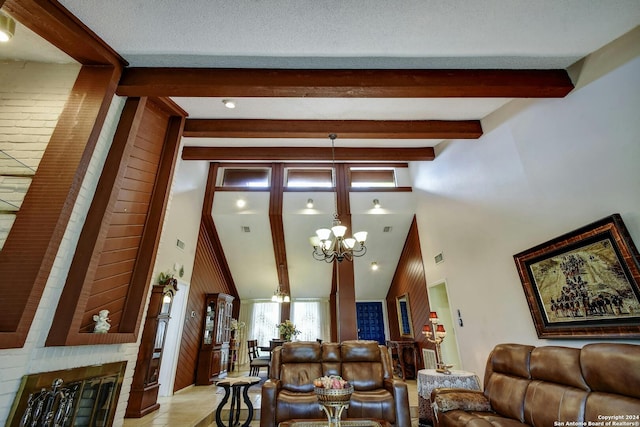 living room featuring beam ceiling, a chandelier, a high ceiling, and a textured ceiling