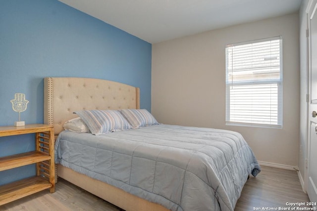 bedroom featuring light wood-type flooring