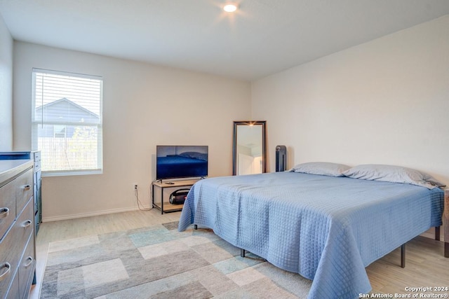 bedroom with light hardwood / wood-style floors