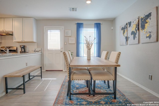 dining room with light wood-type flooring