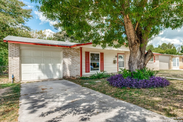 single story home featuring a garage