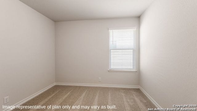 unfurnished room with light carpet