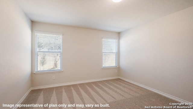 empty room with light colored carpet