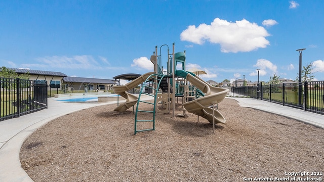 view of play area featuring a community pool