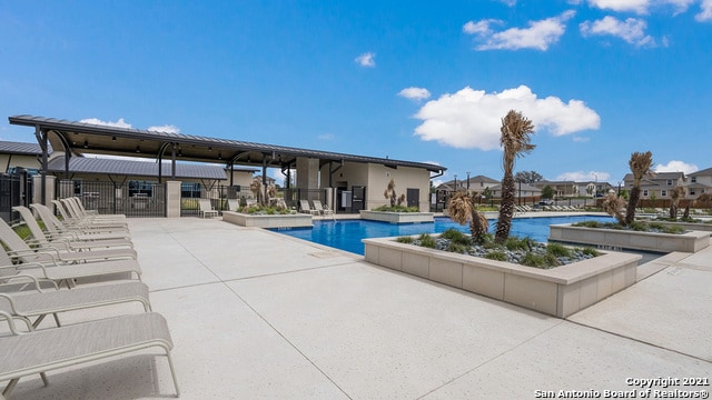 view of swimming pool with a patio area