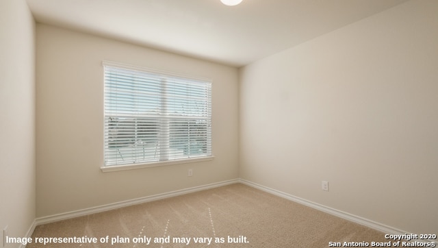 unfurnished room with carpet and a healthy amount of sunlight