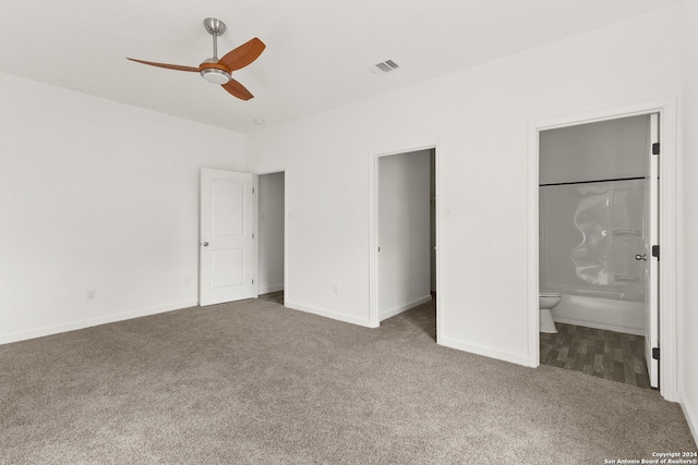 unfurnished bedroom featuring carpet, ceiling fan, and ensuite bathroom