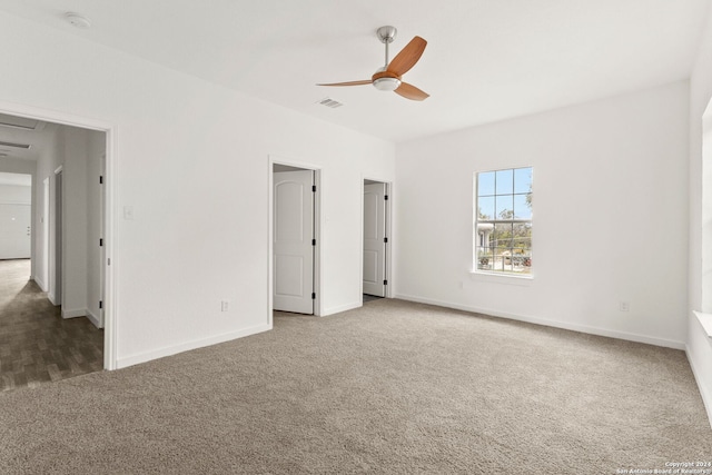 unfurnished bedroom with ceiling fan and carpet