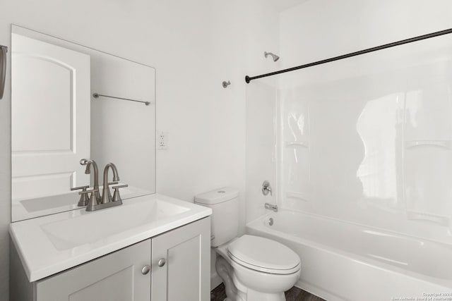 full bathroom featuring bathing tub / shower combination, vanity, toilet, and hardwood / wood-style floors