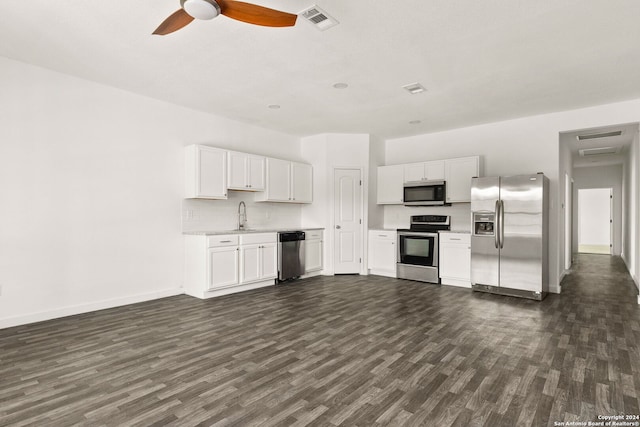 kitchen featuring stainless steel appliances, white cabinetry, ceiling fan, and dark wood-type flooring