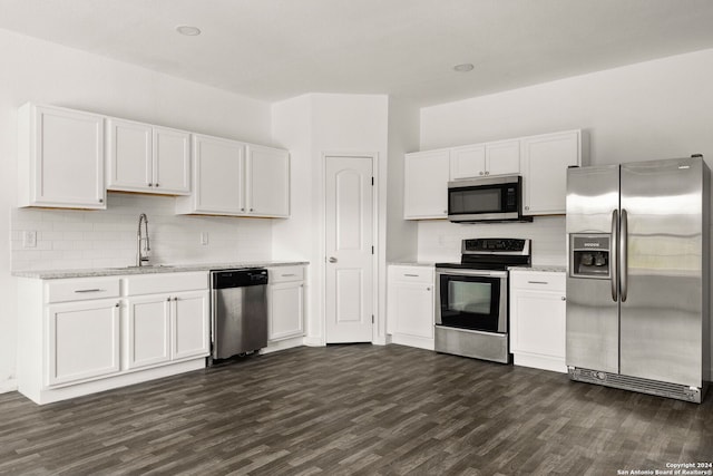 kitchen featuring white cabinetry, sink, dark wood-type flooring, and stainless steel appliances