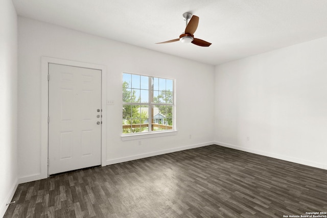 foyer with ceiling fan and dark wood-type flooring