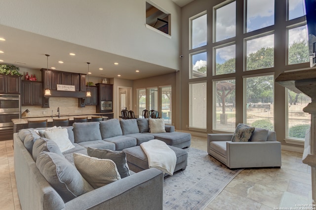 living room with a high ceiling