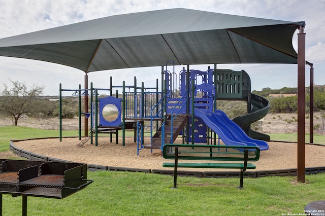 view of playground with a yard