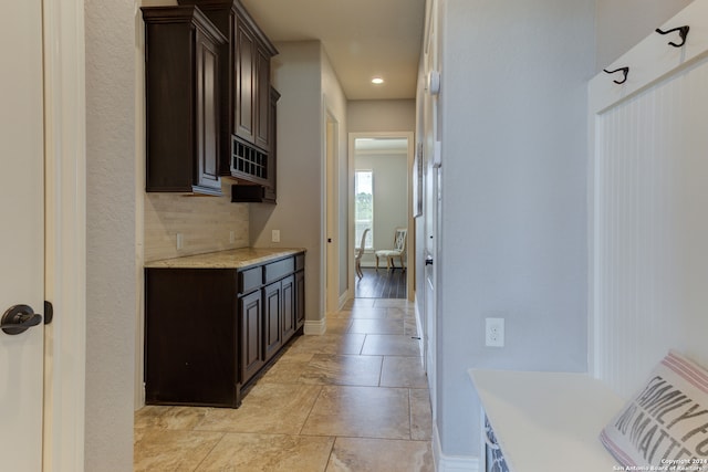 kitchen featuring dark brown cabinetry