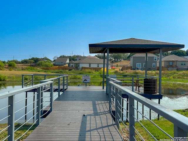 dock area featuring a gazebo and a water view