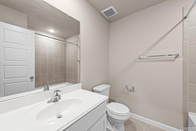 bathroom featuring vanity, tile patterned floors, and toilet