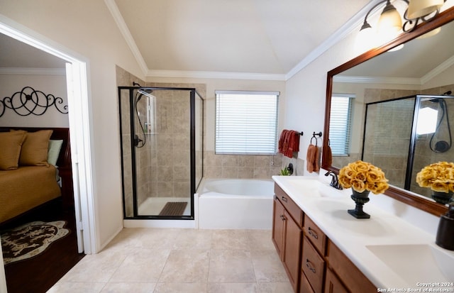 bathroom with tile patterned floors, crown molding, vanity, and separate shower and tub