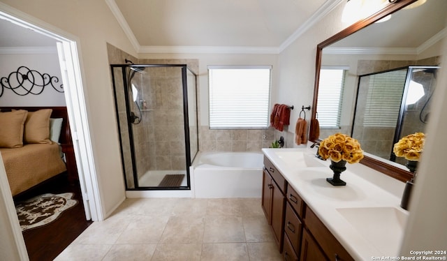 bathroom with crown molding, vanity, separate shower and tub, and tile patterned floors