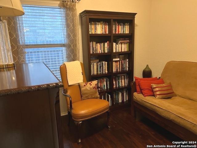 sitting room with dark hardwood / wood-style floors