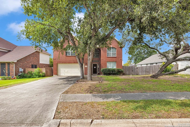 front facade featuring a garage and a front yard