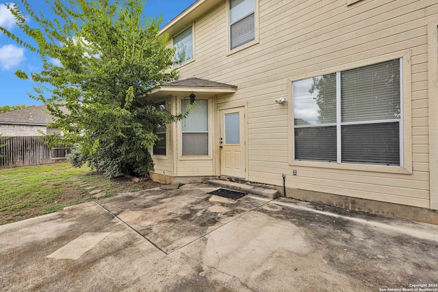 doorway to property with a patio