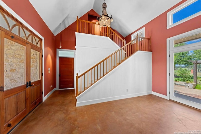 foyer featuring high vaulted ceiling