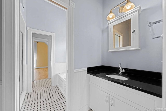 bathroom with a bathing tub and vanity