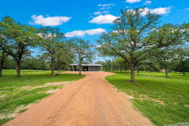 view of property's community featuring a lawn