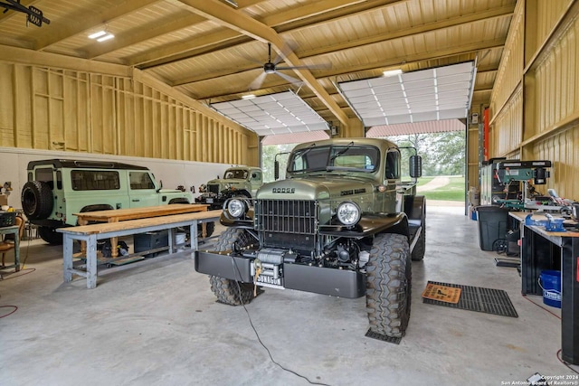 garage with a carport and a workshop area