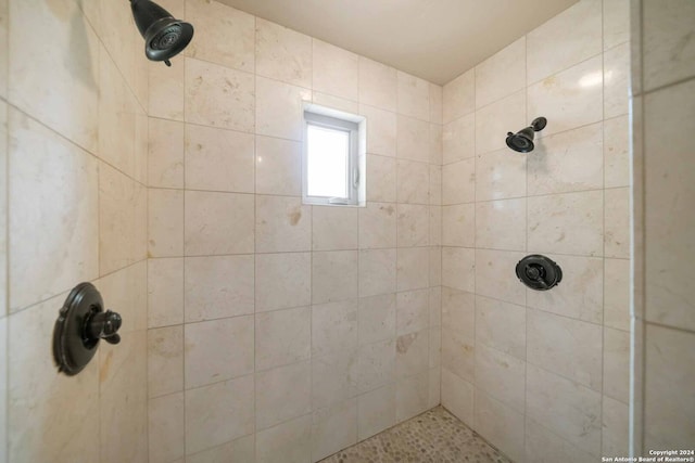 interior space featuring a tile shower