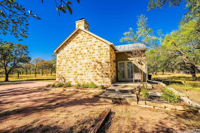 back of property featuring french doors