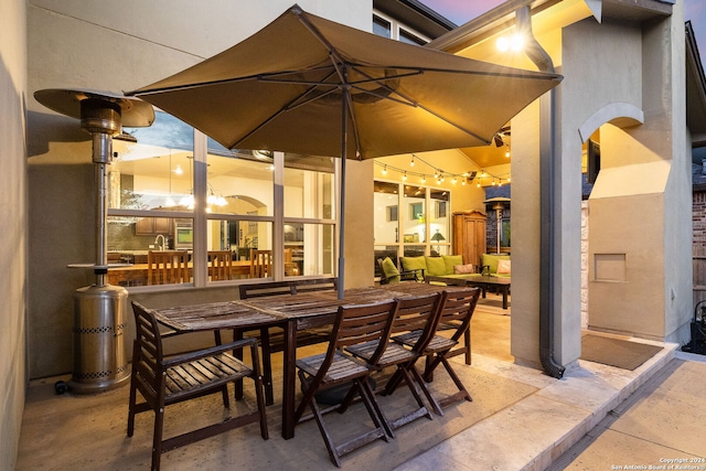 view of patio terrace at dusk