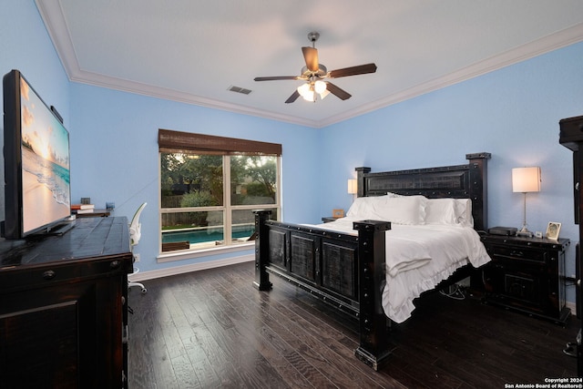 bedroom with ceiling fan, dark hardwood / wood-style floors, and crown molding