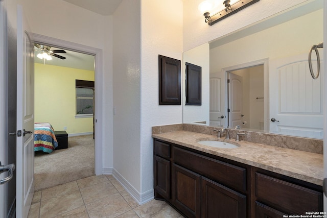 bathroom featuring tile patterned flooring, ceiling fan, and vanity