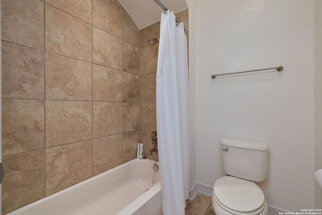 bathroom featuring shower / tub combo with curtain and toilet