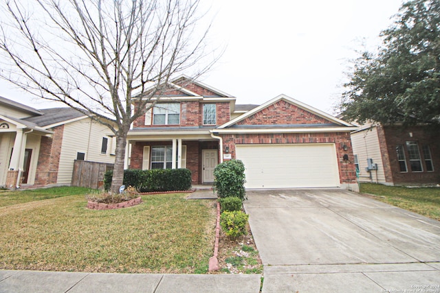 view of front of house with a front yard, a garage, and covered porch