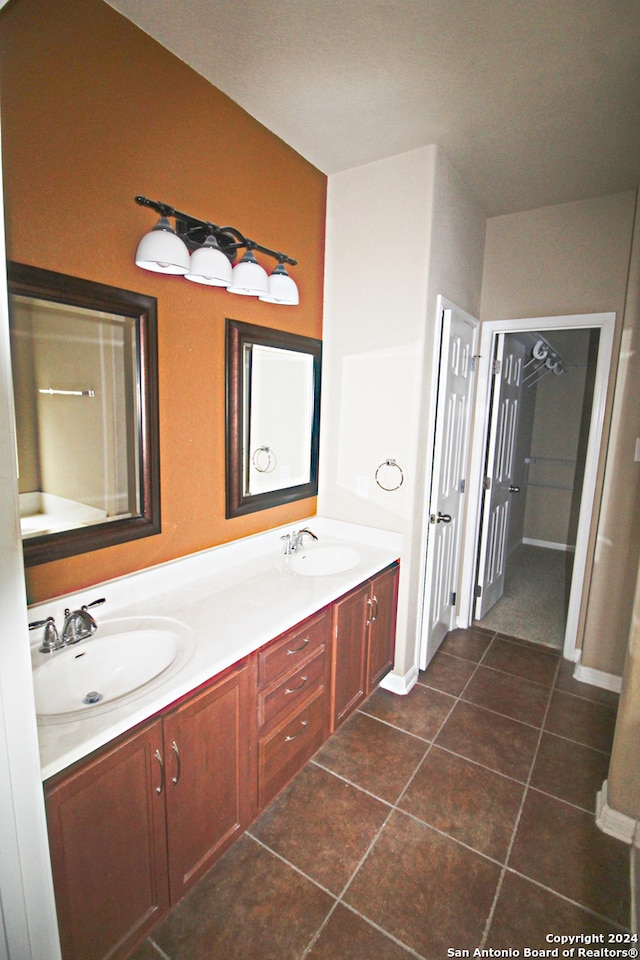 bathroom with tile patterned flooring and vanity